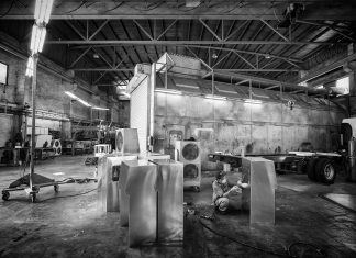 Hey, Hey We’re the MINIs! Mr Chong Siew Yin fabricating the interior covers for the negative pressure system.