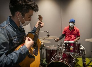 Performing Pop Music Offers Stress Relief and Confidence-Building for Youth Mr David Choo, 30, champions REACH Rock Steady, a year-long programme that uses music to build confidence for youths through practice and performance.