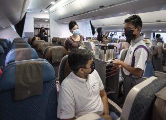 ‘Inside Singapore Airlines’ Takes Flight and Gives Back An SIA flight stewardess guides students from Northlight School on the basics of inflight service in a mockup cabin of an Airbus A380