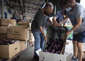Community Fridges: When Food Waste is Good Enough to Eat Rescuers of produce handle the hard work of collecting fruit and vegetables from Pasir Panjang Wholesale Market.