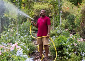 Planting Marsiling’s Own Eden Mr Ganesh Kumar waters the plants he grows at Woodlands Botanical Garden. He hopes the flowers, biodiversity, and garden community will continue to grow and thrive.