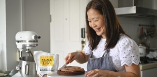 Baking Time for Those in Need Social media influencer, Ms Annette Tan decorates a chocolate cake for Baked for Good SG.
