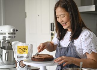 Baking Time for Those in Need Social media influencer, Ms Annette Tan decorates a chocolate cake for Baked for Good SG.